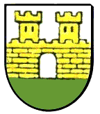 Wappen von Schillingstadt: gelbe Burg auf einer grünen Wiese vor silbernem Hintergrund